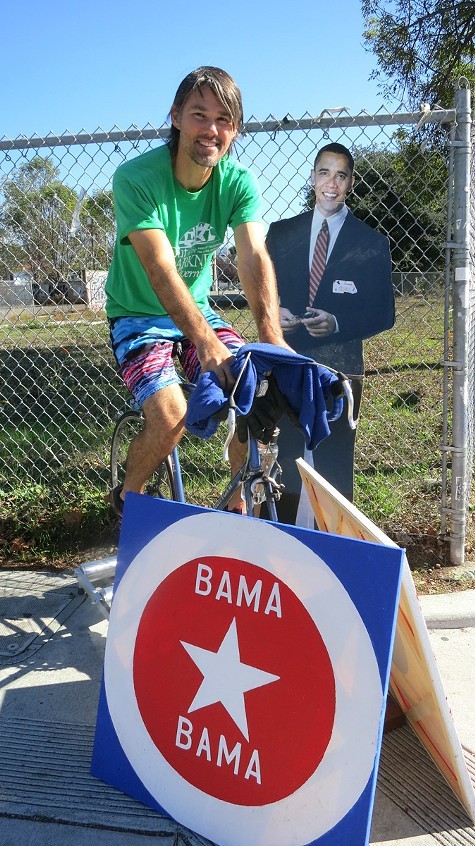 Matthew Szymankowski on his stationary bike in Temescal, reminding his neighbors to vote Matthew Szymankowski on his stationary bike in Temescal, reminding his neighbors to vote