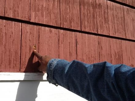 Adam Blueford points out a bullet hole from the night his son was killed.