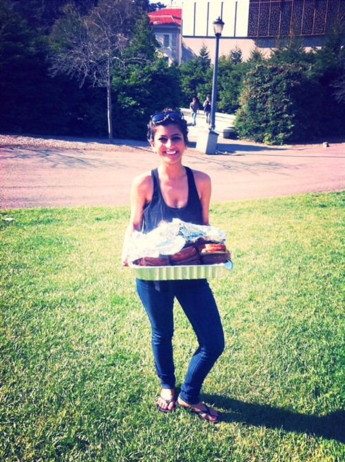 Komal Ahmad picks up some food. Komal Ahmad picks up some food.
